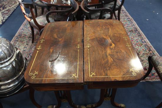 A pair of Regency brass inset rosewood card tables, W.2ft 11in. D.1ft 5.5in. H.2ft 5in.